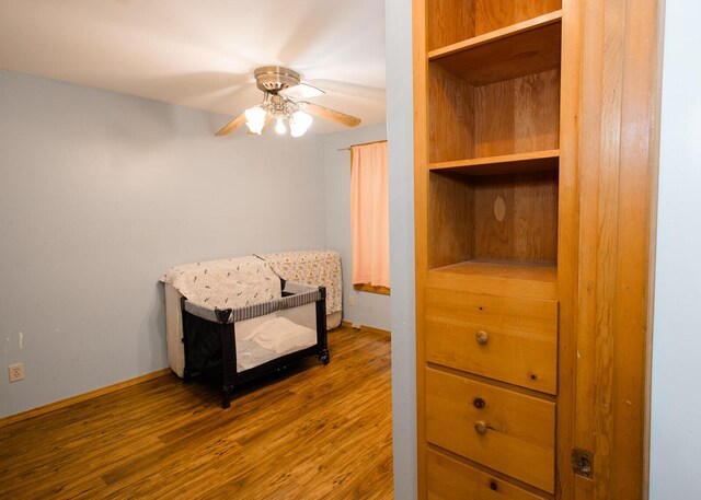 19429 E State Highway 14, Ava, MO 65608 - bedroom featuring wood finished floors, a ceiling fan, and baseboards