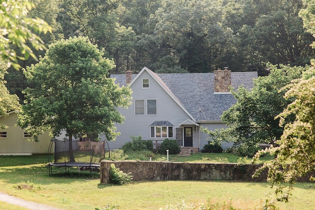 19429 E State Highway 14, Ava, MO 65608 - view of front of property featuring a chimney, a trampoline, a front lawn, and roof with shingles