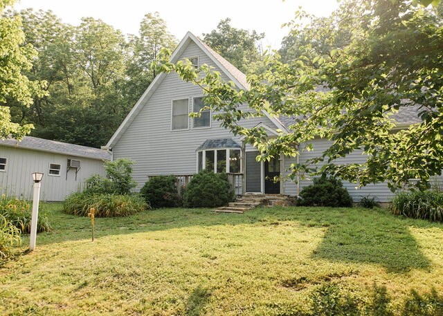 19429 E State Highway 14, Ava, MO 65608 - view of front of home with a front lawn, a wall mounted AC, and roof with shingles