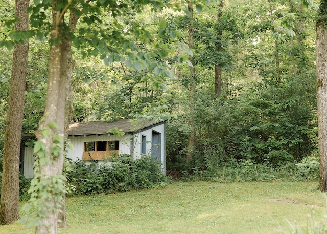 19429 E State Highway 14, Ava, MO 65608 - view of grassy yard with a wooded view and an outbuilding