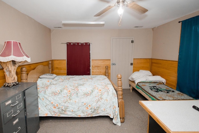 19429 E State Highway 14, Ava, MO 65608 - bedroom with carpet, ceiling fan, wooden walls, and wainscoting