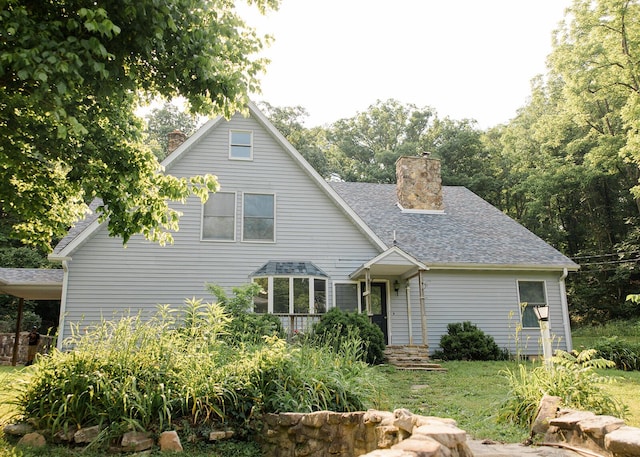 19429 E State Highway 14, Ava, MO 65608 - rear view of house with a chimney and a shingled roof