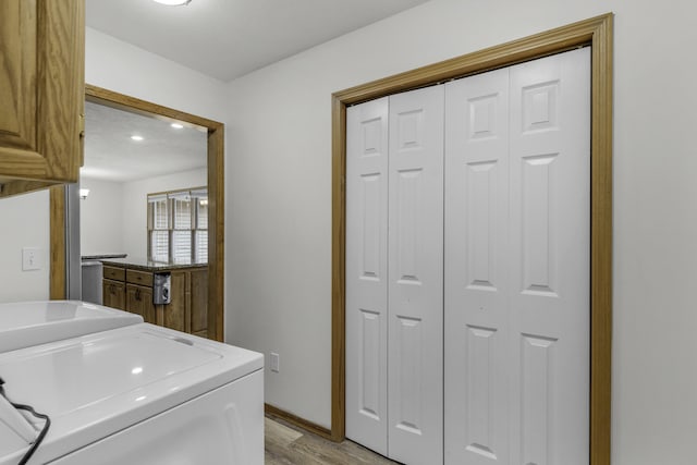 1605 S Meadowview Ave, Springfield, MO 65804 - washroom with washer and dryer, light wood-type flooring, cabinet space, and recessed lighting