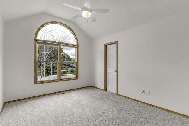 1605 S Meadowview Ave, Springfield, MO 65804 - carpeted spare room featuring vaulted ceiling, a ceiling fan, and baseboards