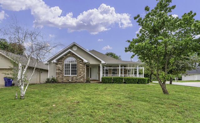 1605 S Meadowview Ave, Springfield, MO 65804 - view of front of house featuring a porch, brick siding, and a front lawn