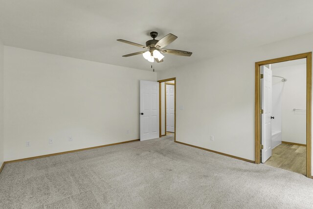 1605 S Meadowview Ave, Springfield, MO 65804 - unfurnished bedroom with light colored carpet, baseboards, and a ceiling fan