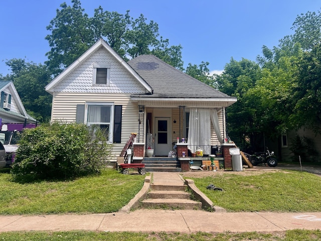 733 W Brower St, Springfield, MO 65802 - view of front of home featuring a porch and a front lawn