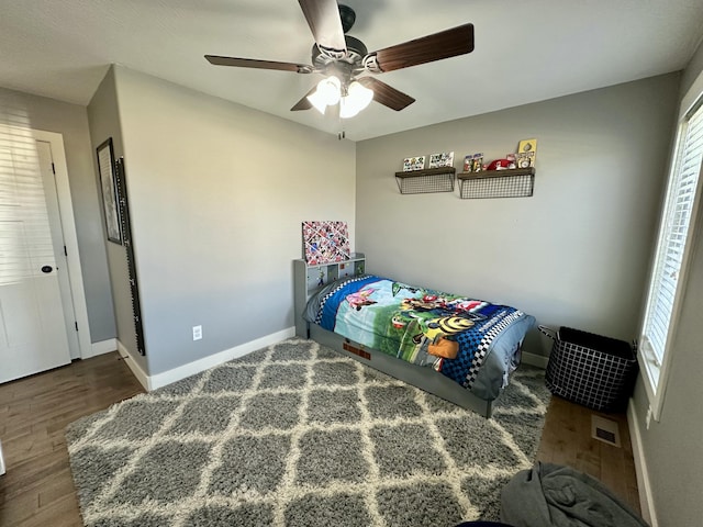 923 Riverview Rd, Marshfield, MO 65706 - bedroom featuring wood finished floors, baseboards, and ceiling fan