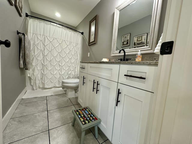 923 Riverview Rd, Marshfield, MO 65706 - bathroom with vanity, toilet, tile patterned flooring, and baseboards