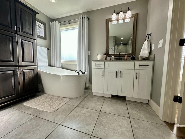 923 Riverview Rd, Marshfield, MO 65706 - bathroom with vanity, a freestanding bath, baseboards, and tile patterned flooring