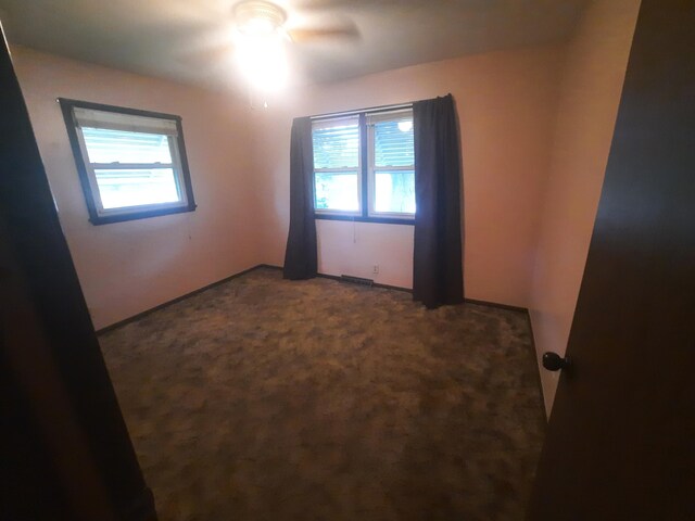 2504 N Clayton Ave, Springfield, MO 65803 - empty room with a ceiling fan and carpet flooring