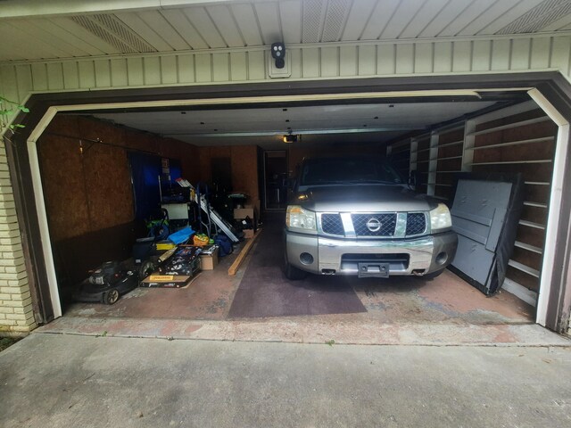 2504 N Clayton Ave, Springfield, MO 65803 - garage with driveway and a garage door opener