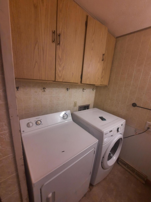 2504 N Clayton Ave, Springfield, MO 65803 - washroom with cabinet space, independent washer and dryer, and tile walls