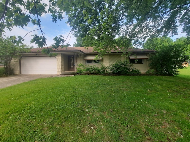 2504 N Clayton Ave, Springfield, MO 65803 - ranch-style house featuring driveway, an attached garage, a front lawn, and brick siding