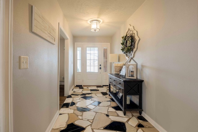 248 Charles Rd, Billings, MO 65610 - foyer with baseboards and a textured ceiling