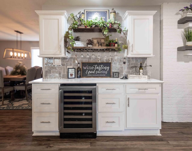 248 Charles Rd, Billings, MO 65610 - indoor dry bar with beverage cooler, tasteful backsplash, and dark wood-type flooring