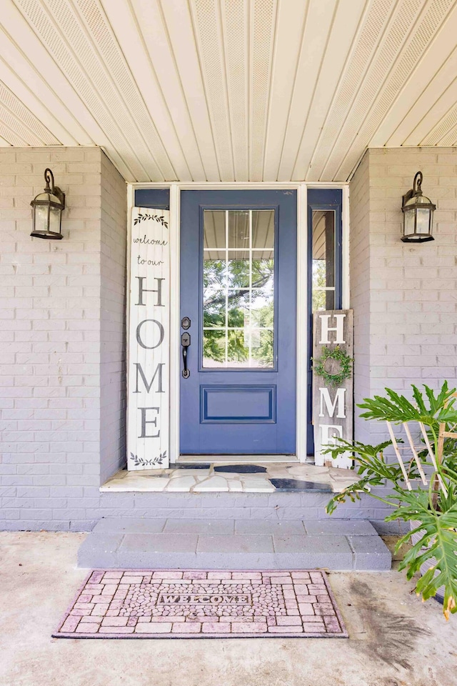 248 Charles Rd, Billings, MO 65610 - doorway to property featuring a porch and brick siding