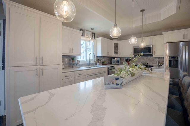 248 Charles Rd, Billings, MO 65610 - kitchen with a sink, appliances with stainless steel finishes, backsplash, and white cabinets