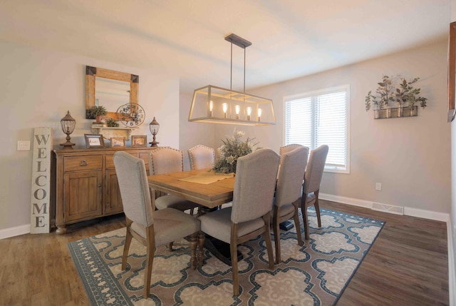 248 Charles Rd, Billings, MO 65610 - dining room featuring dark wood-style flooring and baseboards