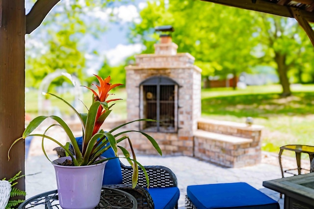 248 Charles Rd, Billings, MO 65610 - view of patio with an outdoor brick fireplace and outdoor dining area