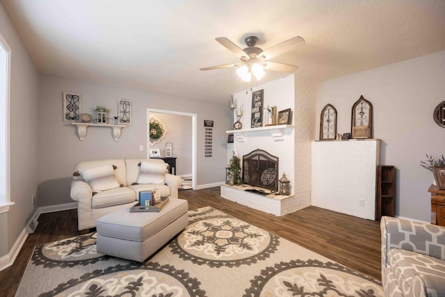 248 Charles Rd, Billings, MO 65610 - living area featuring wood finished floors, ceiling fan, a brick fireplace, and baseboards