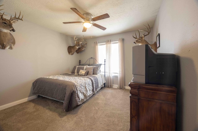 248 Charles Rd, Billings, MO 65610 - bedroom featuring light colored carpet, a textured ceiling, a ceiling fan, and baseboards