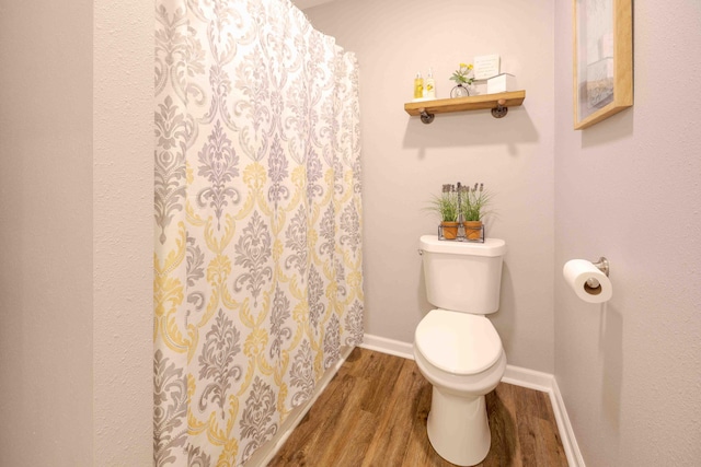 248 Charles Rd, Billings, MO 65610 - full bathroom with toilet, wood finished floors, a shower with shower curtain, and baseboards
