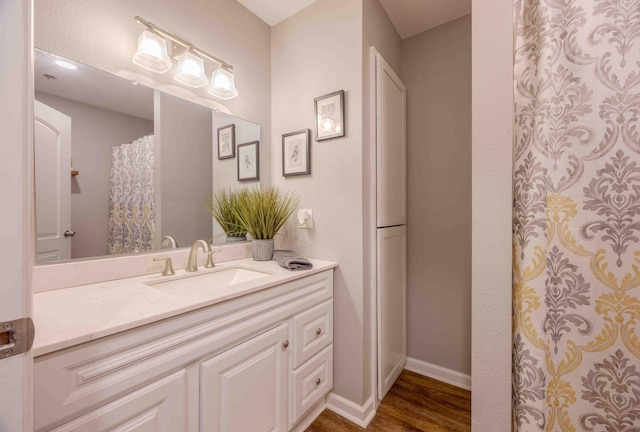 248 Charles Rd, Billings, MO 65610 - bathroom with vanity, wood finished floors, and baseboards