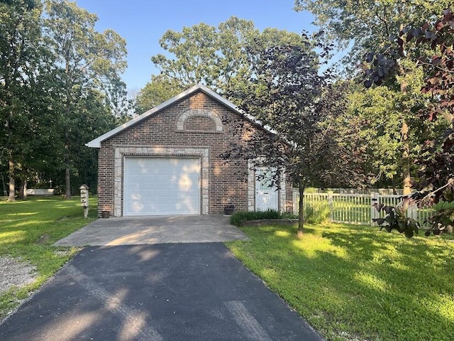 4120 S 119th Rd, Bolivar, MO 65613 - view of front of home featuring brick siding, asphalt driveway, and a detached garage