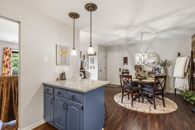 150 Sunken Forest Dr Unit 106, Forsyth, MO 65653 - kitchen featuring blue cabinetry, dark wood-style floors, a peninsula, a chandelier, and baseboards