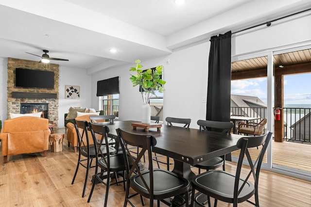 400 Poolside Pass, Hollister, MO 65672 - dining area featuring plenty of natural light, a ceiling fan, light wood-type flooring, a fireplace, and recessed lighting