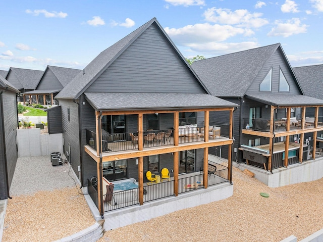 400 Poolside Pass, Hollister, MO 65672 - rear view of house with roof with shingles and a patio area