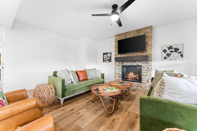 400 Poolside Pass, Hollister, MO 65672 - living room with wood finished floors, a fireplace, and ceiling fan