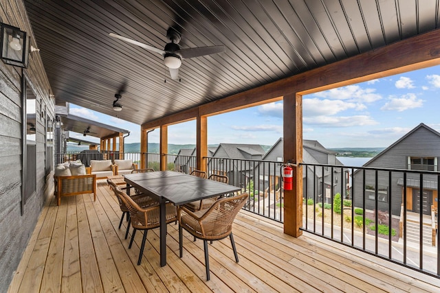 400 Poolside Pass, Hollister, MO 65672 - wooden terrace featuring a ceiling fan, an outdoor living space, a water view, and outdoor dining area