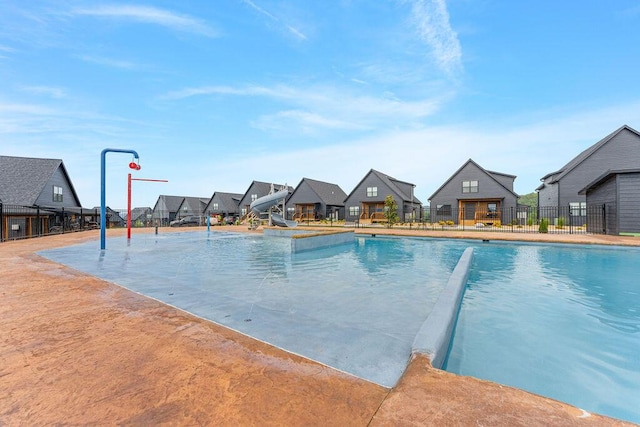 400 Poolside Pass, Hollister, MO 65672 - community pool featuring a water slide and a residential view