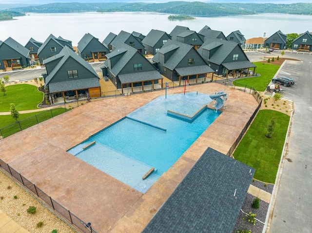 400 Poolside Pass, Hollister, MO 65672 - view of swimming pool featuring a water view, a water slide, and a residential view