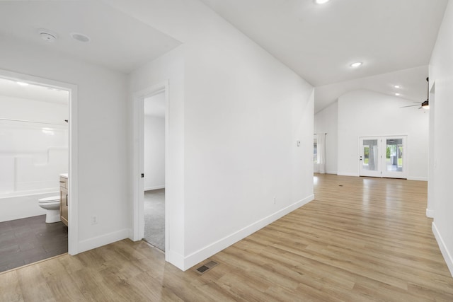 1257 W Gaslight Dr, Springfield, MO 65810 - corridor featuring light wood finished floors, vaulted ceiling, baseboards, and recessed lighting
