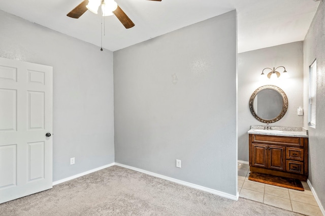 318 W Olive St, Aurora, MO 65605 - unfurnished bedroom featuring a sink, baseboards, light carpet, and a ceiling fan