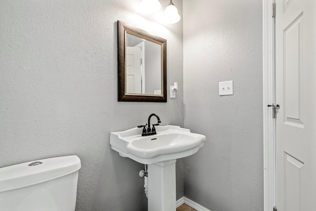 318 W Olive St, Aurora, MO 65605 - half bath with toilet and a sink
