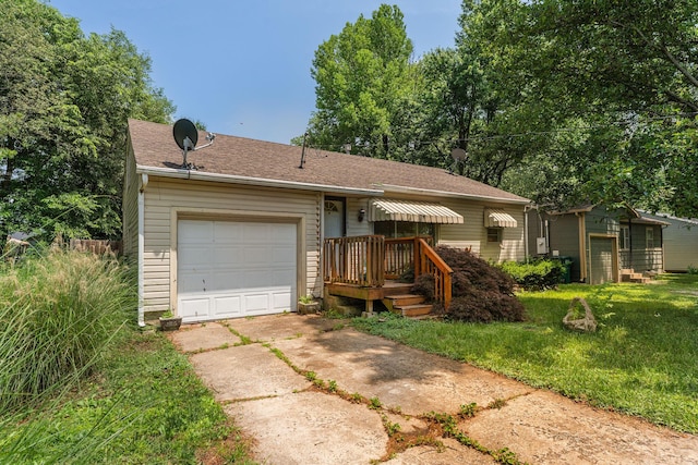 2140 N Crutcher Ave, Springfield, MO 65803 - ranch-style house featuring concrete driveway, a garage, a front lawn, and a shingled roof