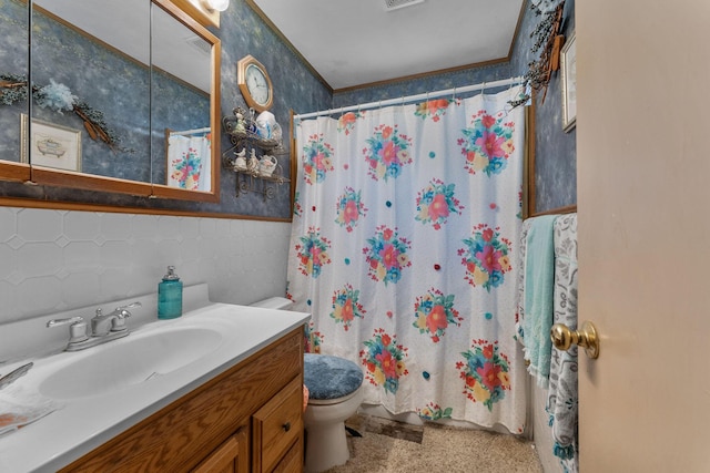 2140 N Crutcher Ave, Springfield, MO 65803 - full bath with wallpapered walls, toilet, vanity, wainscoting, and a shower with shower curtain