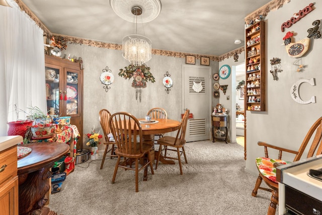 2140 N Crutcher Ave, Springfield, MO 65803 - dining room with carpet and a chandelier