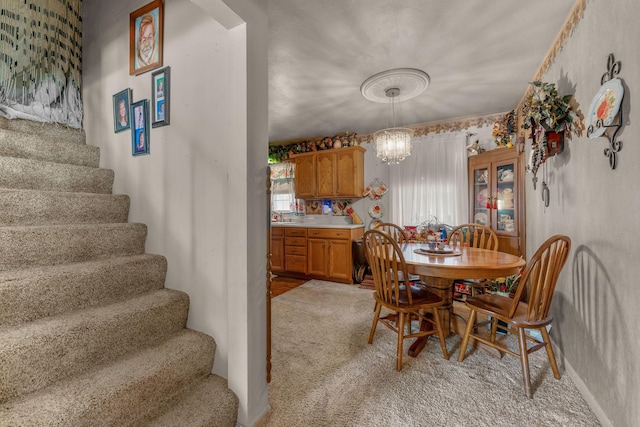 2140 N Crutcher Ave, Springfield, MO 65803 - dining room featuring light carpet, stairway, and a chandelier
