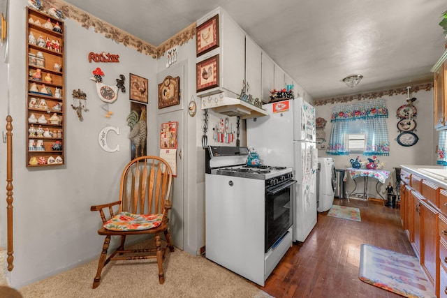 2140 N Crutcher Ave, Springfield, MO 65803 - kitchen with range with gas stovetop, washer / dryer, dark wood-type flooring, and light countertops
