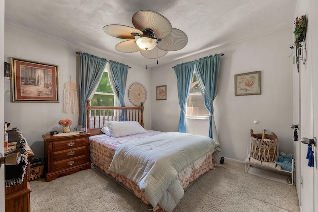2140 N Crutcher Ave, Springfield, MO 65803 - bedroom featuring light carpet and a ceiling fan