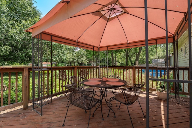 2140 N Crutcher Ave, Springfield, MO 65803 - wooden terrace featuring a gazebo and outdoor dining space