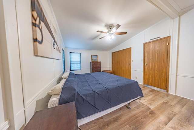 25832 County Road 250, Hermitage, MO 65668 - bedroom with lofted ceiling, wood finished floors, ornamental molding, and a ceiling fan