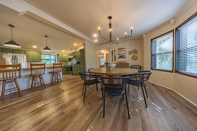 25832 County Road 250, Hermitage, MO 65668 - dining area featuring crown molding, dark wood-style flooring, a chandelier, and recessed lighting