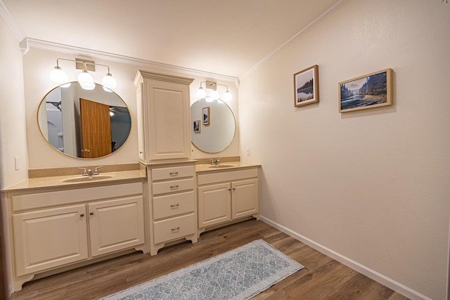 25832 County Road 250, Hermitage, MO 65668 - full bathroom with double vanity, wood finished floors, ornamental molding, and baseboards