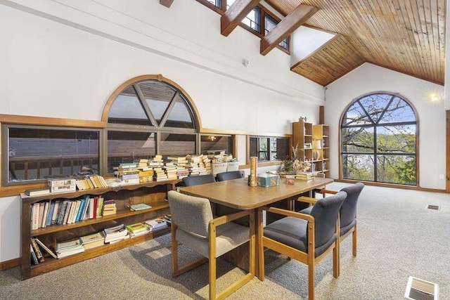 234 Sunset Cv Unit 107, Branson, MO 65616 - carpeted dining space with high vaulted ceiling and wooden ceiling
